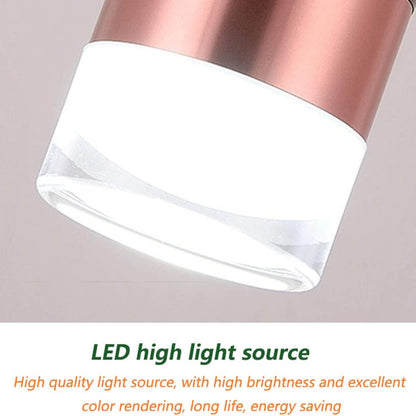 LED light source with copper top and white base on a gray background